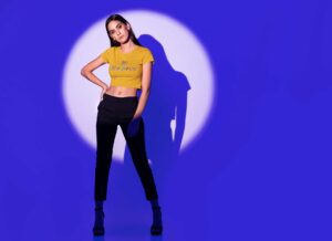 bella-canvas-crop-top-mockup-featuring-a-woman-standing-in-a-spotlight-m28973