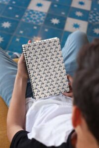 mockup-of-a-notebook-held-by-a-brunette-boy-24144 (1)