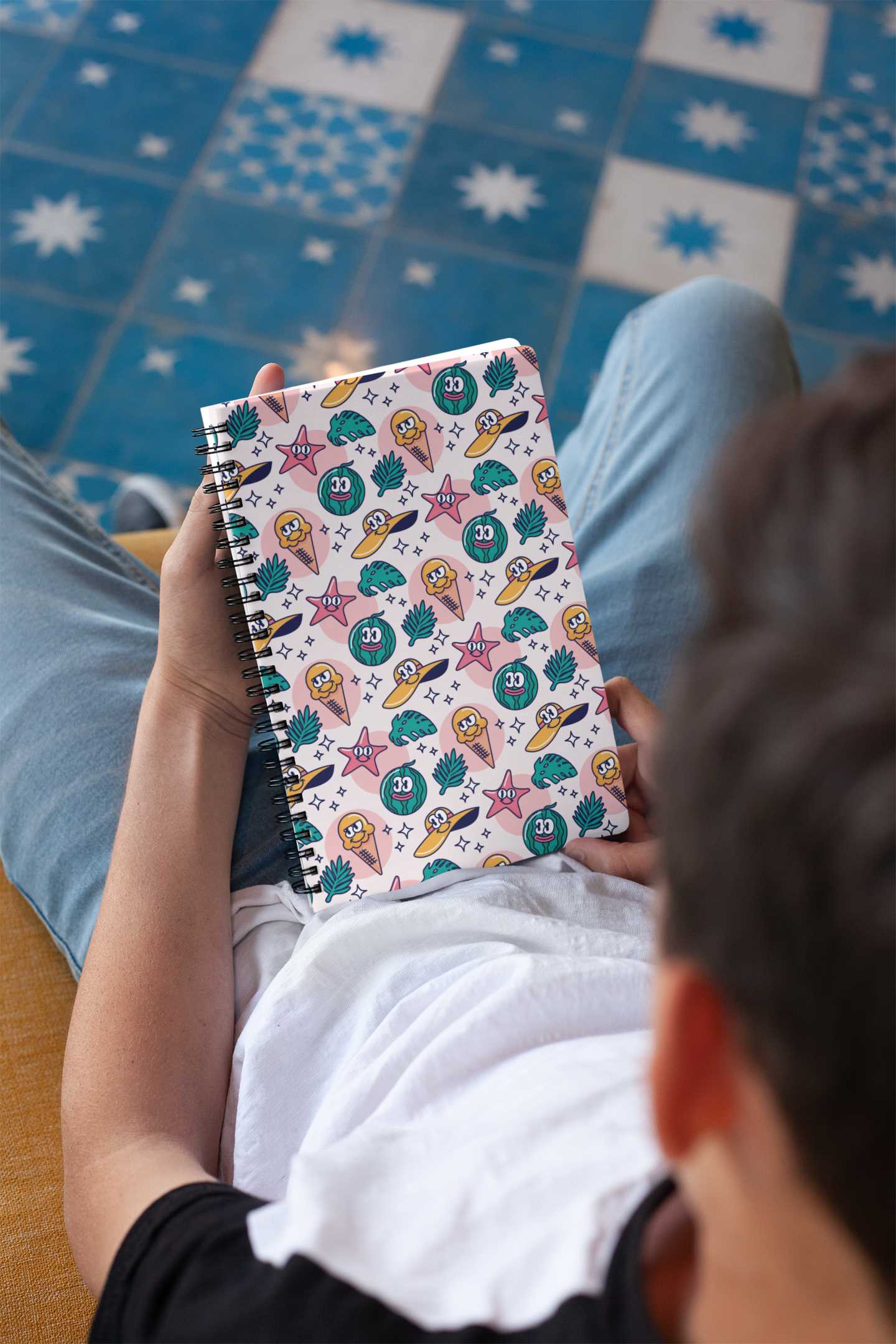 mockup-of-a-notebook-held-by-a-brunette-boy-24144
