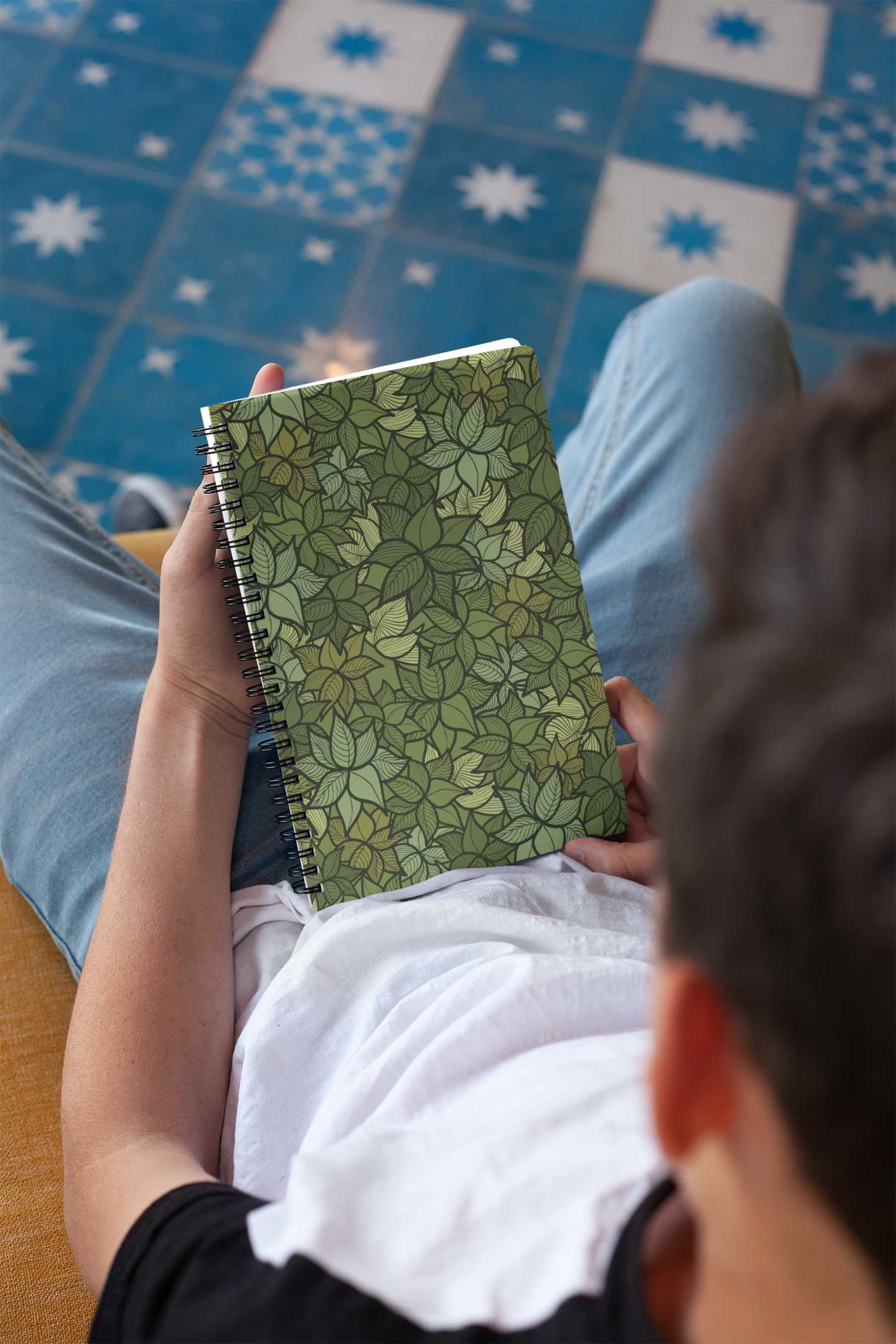 mockup-of-a-notebook-held-by-a-brunette-boy-24144