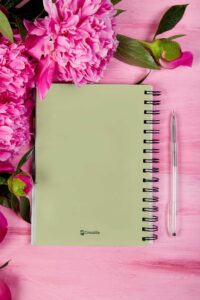 notebook-mockup-featuring-flowers-and-a-pen-m32051-r-el2