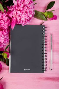 notebook-mockup-featuring-flowers-and-a-pen-m32051-r-el2