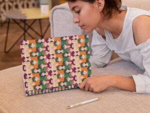 spiral-notebook-mockup-featuring-a-woman-reading-29955