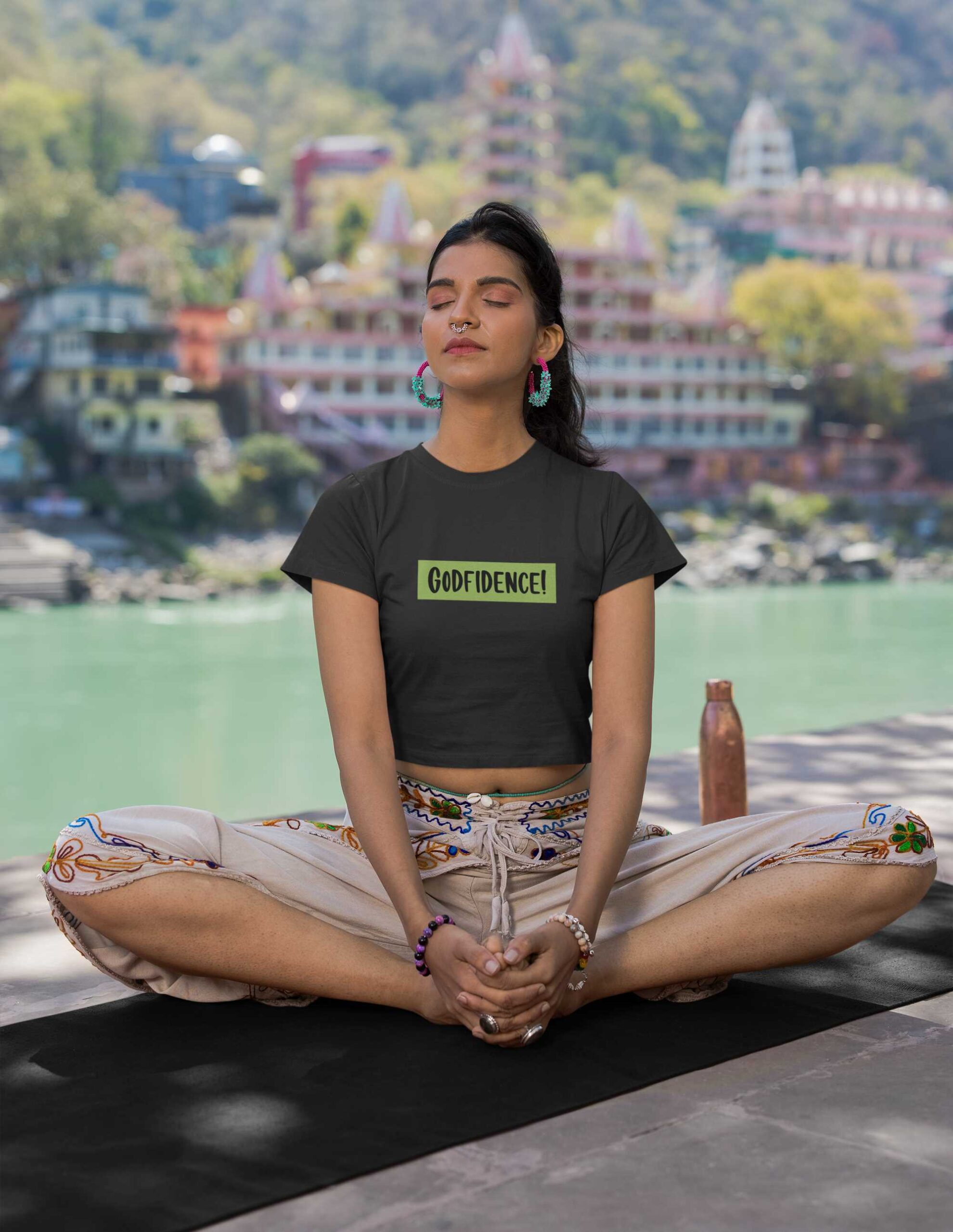 crop-top-mockup-featuring-a-woman-meditating-next-to-a-lake-m33671