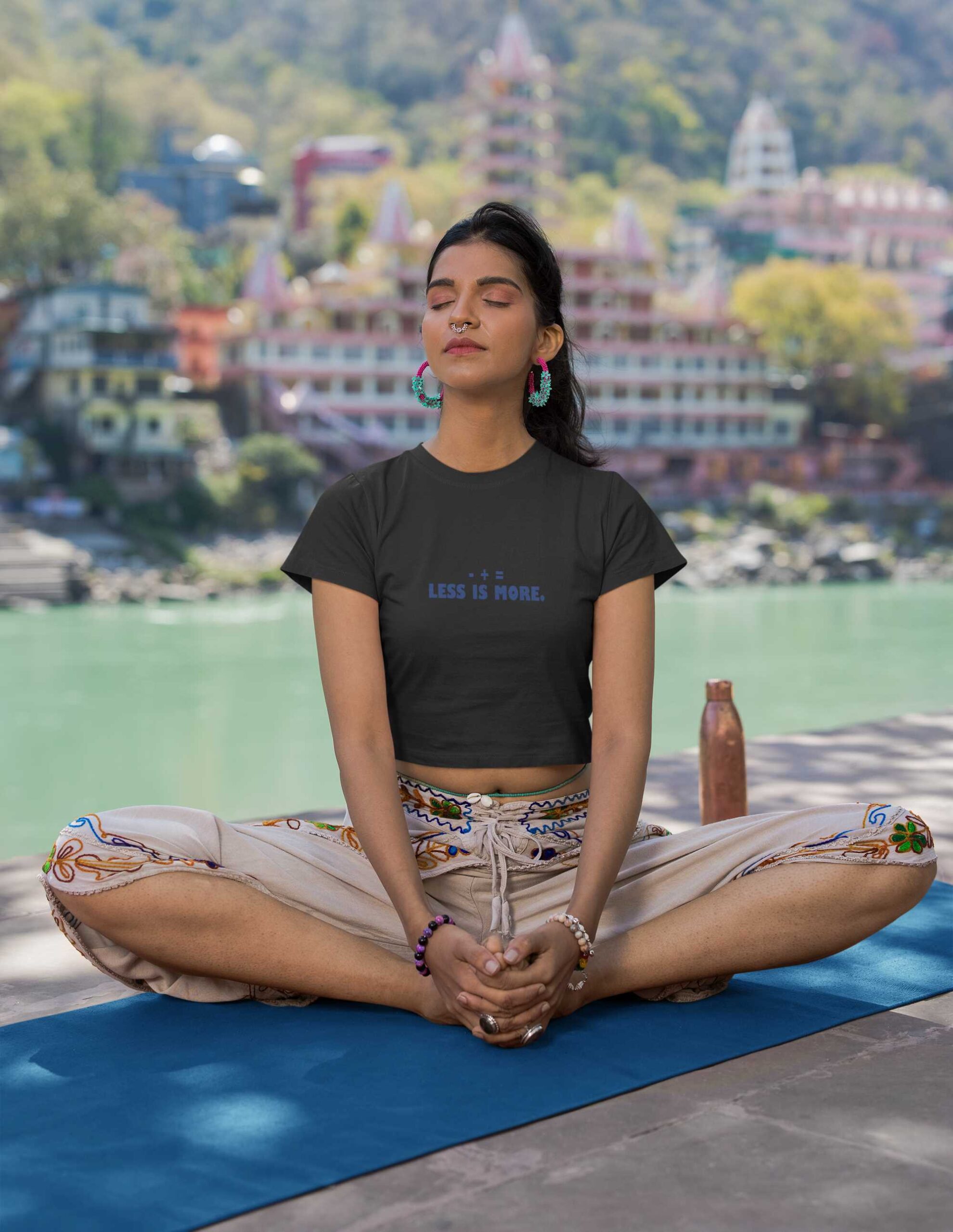 crop-top-mockup-featuring-a-woman-meditating-next-to-a-lake-m33671