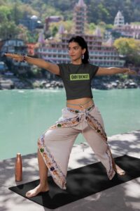 crop-top-mockup-featuring-a-woman-practicing-yoga-by-a-lake-m33670
