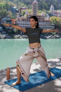 crop-top-mockup-featuring-a-woman-practicing-yoga-by-a-lake-m33670