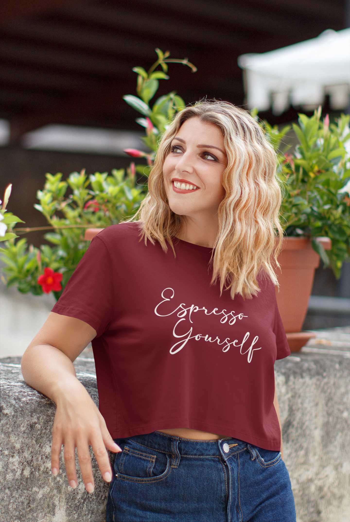 crop-top-t-shirt-mockup-of-a-woman-posing-by-some-plant-pots-45455-r-el2