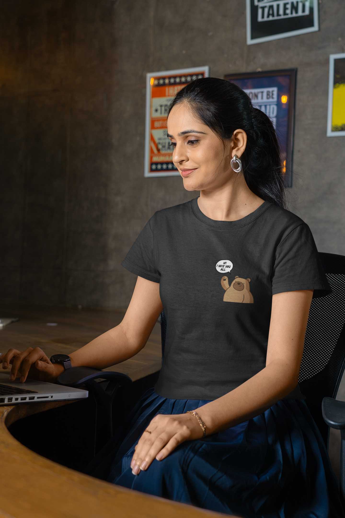 gildan-tee-mockup-of-a-smiling-woman-working-at-an-office-m31761 (1)