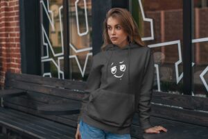 mockup-featuring-a-woman-wearing-a-hoodie-and-posing-by-a-wooden-bench-4783-el1
