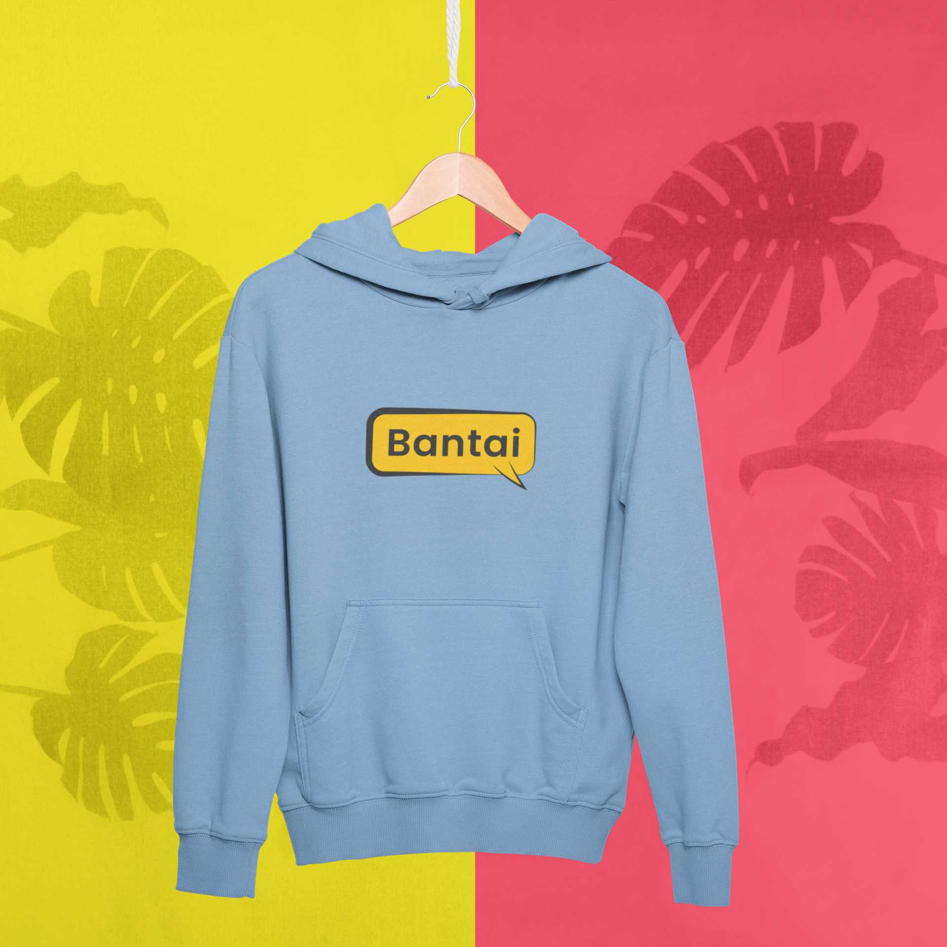 mockup-of-a-hanger-with-a-pullover-hoodie-against-a-tropical-surface-27019