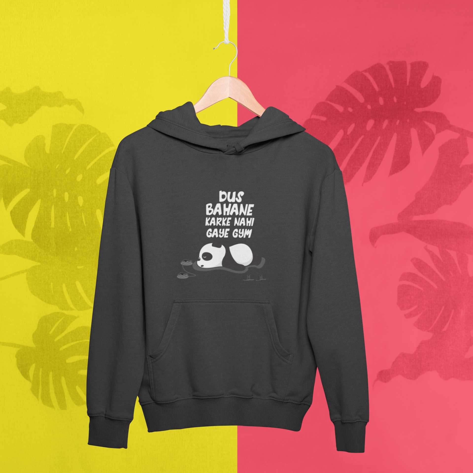 mockup-of-a-hanger-with-a-pullover-hoodie-against-a-tropical-surface-27019