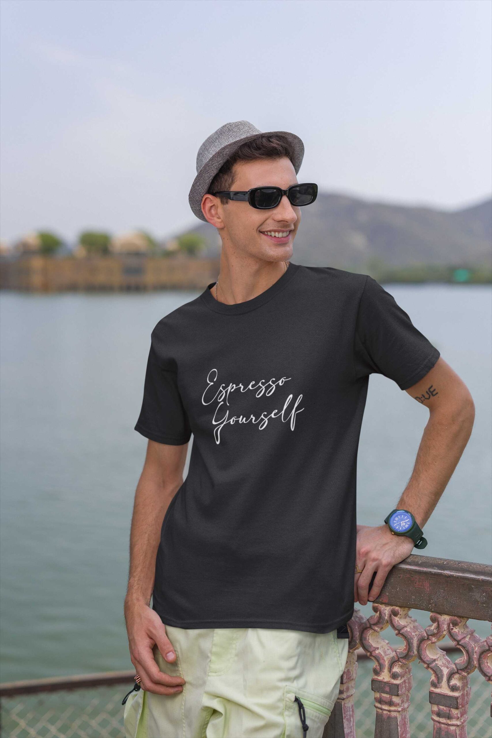 travel-themed-mockup-of-a-cheerful-man-wearing-a-gildan-round-neck-t-shirt-m34644