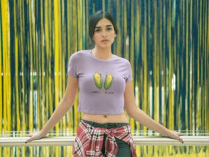 woman-wearing-a-crop-top-tee-mockup-against-a-blue-and-yellow-background-a19531 (1)