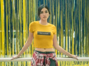 woman-wearing-a-crop-top-tee-mockup-against-a-blue-and-yellow-background-a19531 (1)