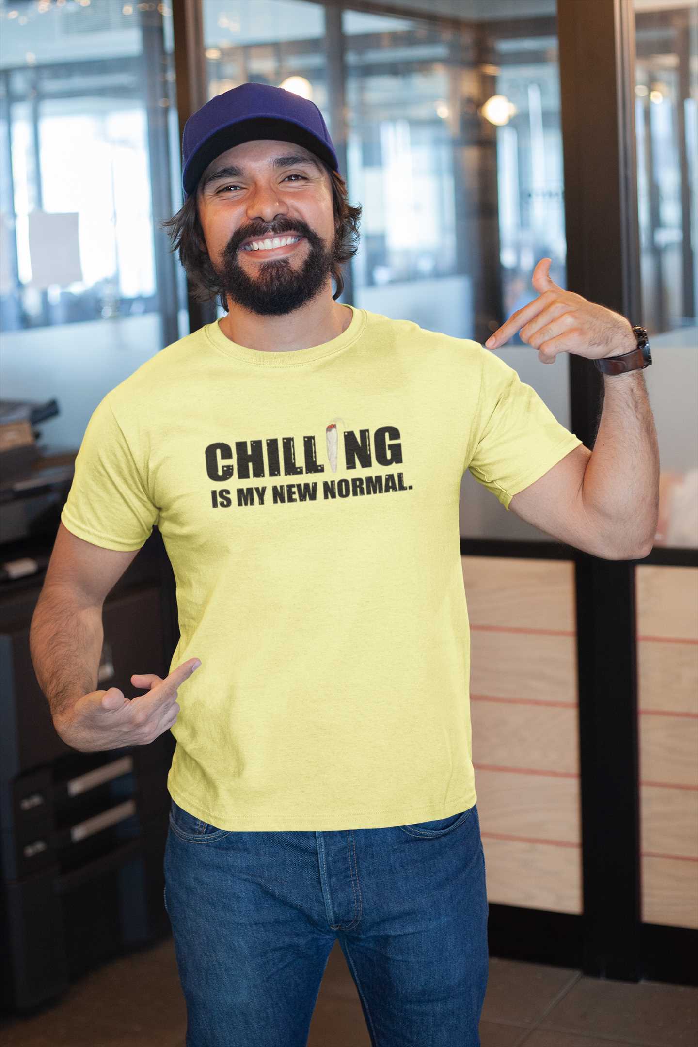 mockup-of-a-happy-customer-showing-off-his-t-shirt-inside-a-modern-office-26189 (1)