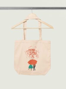 mockup-of-an-econscious-tote-bag-placed-on-a-wooden-hanger-m35323