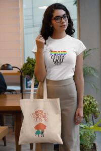 t-shirt-mockup-of-a-woman-holding-a-tote-bag-at-an-office-29413