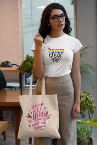 t-shirt-mockup-of-a-woman-holding-a-tote-bag-at-an-office-29413
