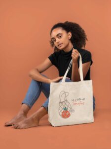 tote-bag-mockup-of-a-young-woman-sitting-barefoot-28865