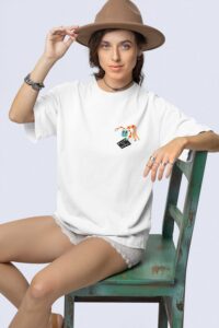 stanley-stella-t-shirt-mockup-featuring-a-woman-with-a-boho-styled-look-sitting-on-an-old-chair-m36870