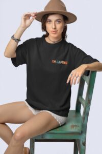 stanley-stella-t-shirt-mockup-featuring-a-woman-with-a-boho-styled-look-sitting-on-an-old-chair-m36870
